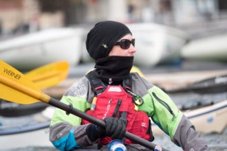 Susannah has the right attire for the day. Drysuit. PFD. Gloves. Beanie+Neck Warmer. In her hatch, she as a storm cag for anyone that goes into the water.
