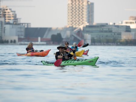 People out on a social kayak paddle in Toronto at Harbourfront Canoe & Kayak Center